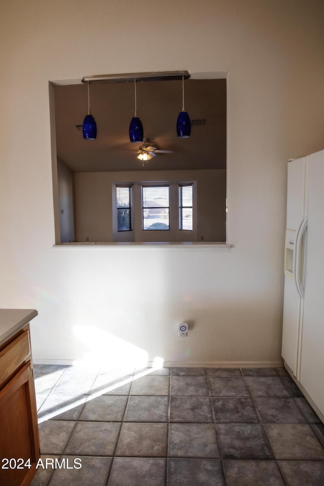 laundry area with ceiling fan