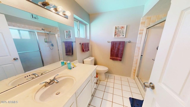 full bathroom featuring visible vents, toilet, tile patterned floors, vanity, and a shower stall