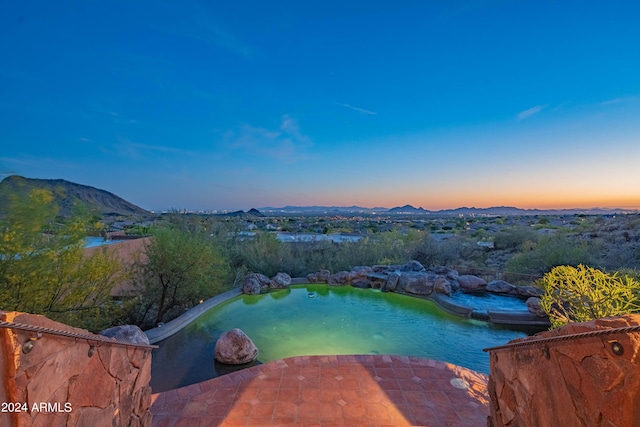 aerial view at dusk with a mountain view