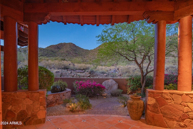 view of patio / terrace with a mountain view