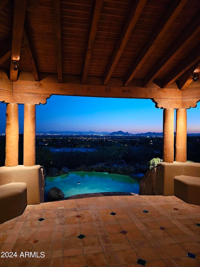 view of pool at dusk