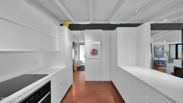 5714 N 11th St, Phoenix, AZ 85014 - hallway featuring finished concrete floors and beamed ceiling