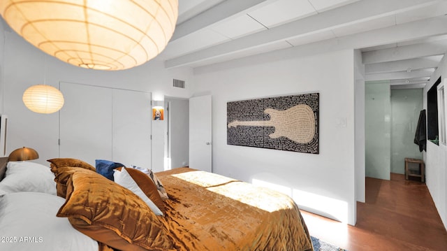 5714 N 11th St, Phoenix, AZ 85014 - bedroom featuring wood finished floors, a closet, and beamed ceiling