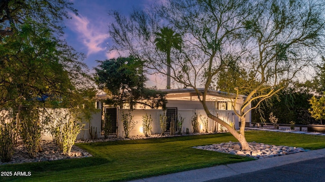 5714 N 11th St, Phoenix, AZ 85014 - mid-century modern home with a front lawn and stucco siding
