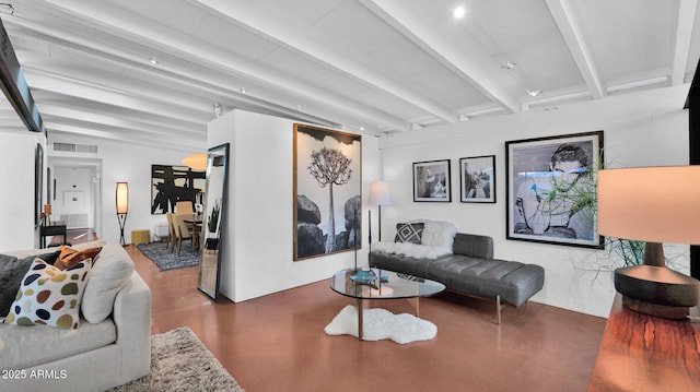 5714 N 11th St, Phoenix, AZ 85014 - living room featuring beam ceiling and concrete flooring