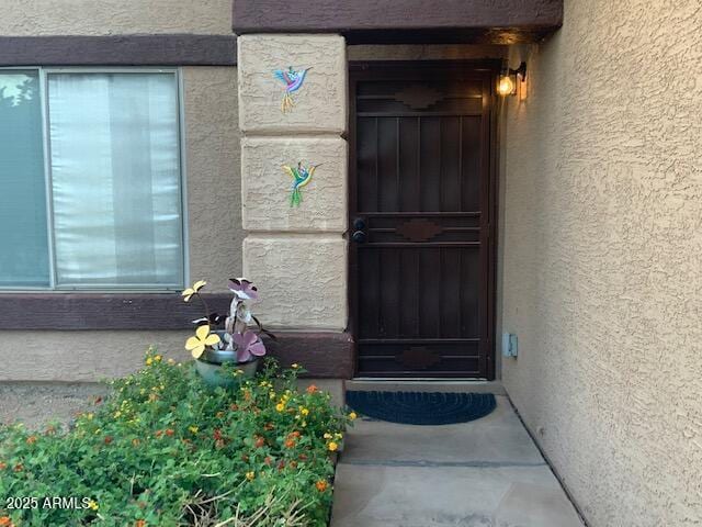 8338 W Coolidge St, Phoenix, AZ 85037 - doorway to property featuring stucco siding