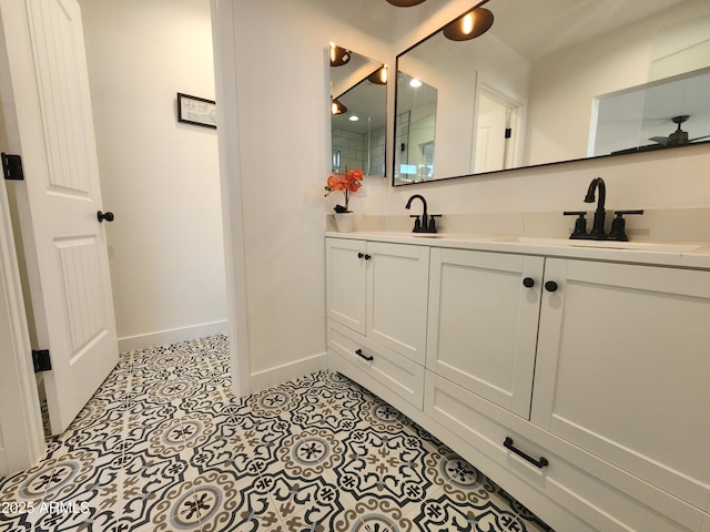 bathroom with tile patterned flooring and vanity