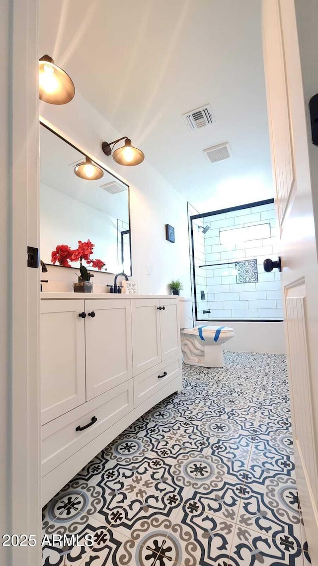 bathroom with vanity and tile patterned floors