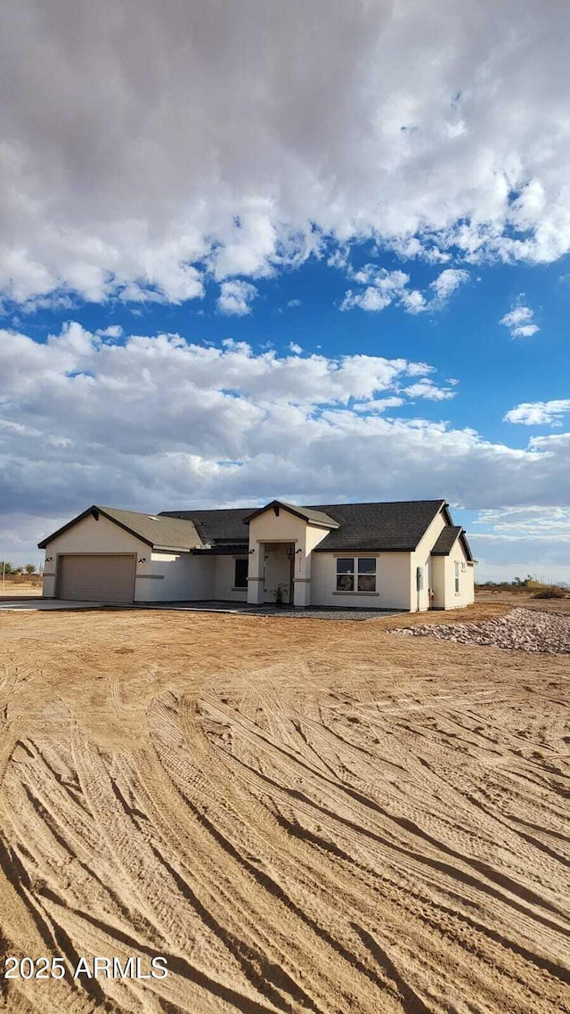 ranch-style house featuring a garage