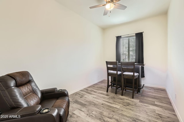 dining space with ceiling fan and light hardwood / wood-style floors