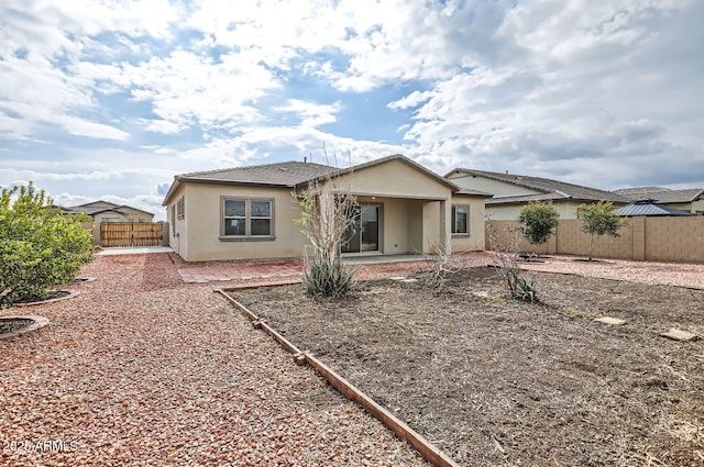 rear view of property featuring a patio