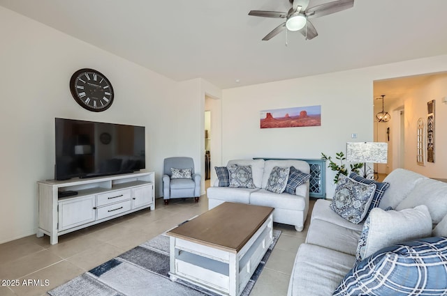 living room with light tile patterned flooring and ceiling fan