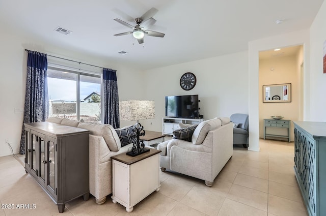 living room with light tile patterned flooring and ceiling fan