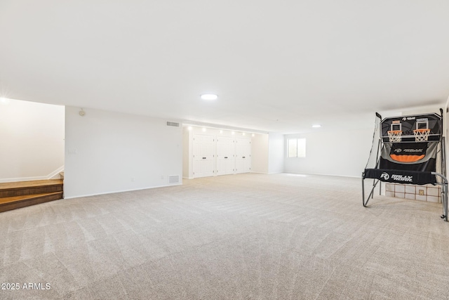 basement with recessed lighting, baseboards, visible vents, and carpet flooring