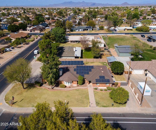 birds eye view of property with a mountain view and a residential view