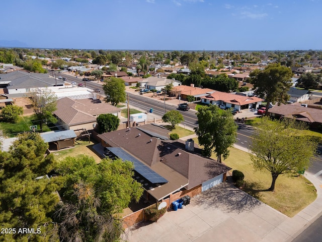 birds eye view of property with a residential view