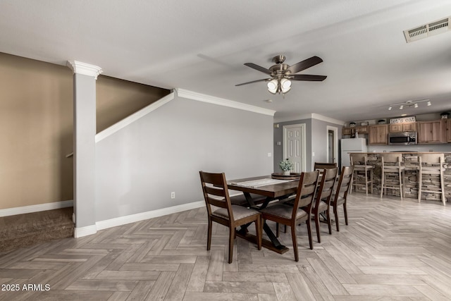 23332 N Serenity Trl, Florence, AZ 85132 - dining room with a ceiling fan and crown molding