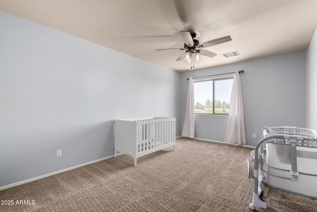 23332 N Serenity Trl, Florence, AZ 85132 - carpeted bedroom featuring ceiling fan and a crib