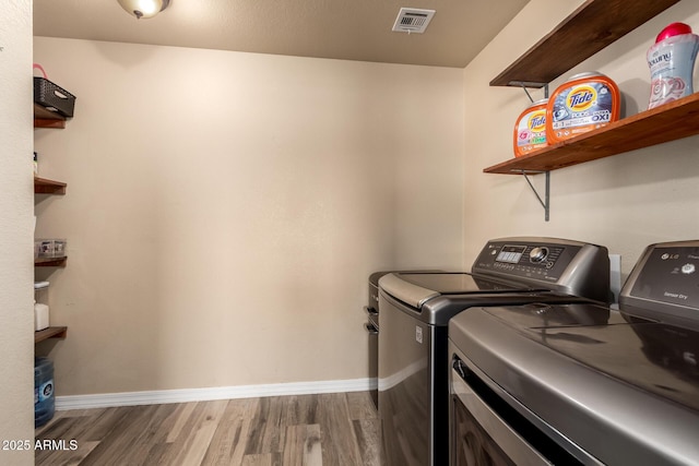 23332 N Serenity Trl, Florence, AZ 85132 - laundry room featuring washer and dryer and wood finished floors