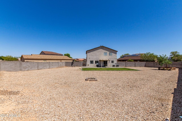 23332 N Serenity Trl, Florence, AZ 85132 - back of property featuring a fenced backyard and a patio area