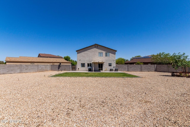 23332 N Serenity Trl, Florence, AZ 85132 - rear view of property featuring a patio and a fenced backyard
