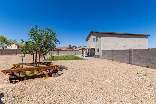 23332 N Serenity Trl, Florence, AZ 85132 - fenced backyard featuring a patio