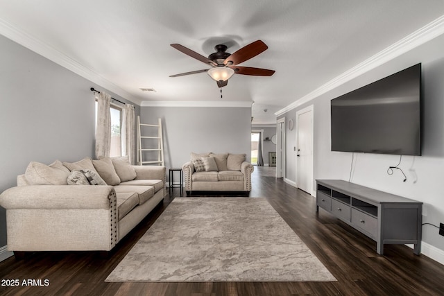23332 N Serenity Trl, Florence, AZ 85132 - living room featuring ceiling fan, crown molding, and dark wood-style flooring