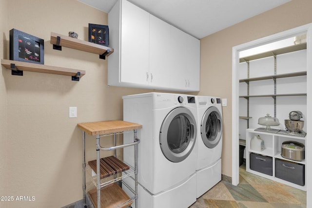 laundry area featuring cabinet space and washer and dryer