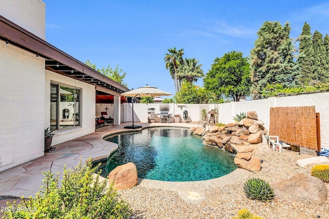 view of pool with a fenced in pool, a patio, and a fenced backyard