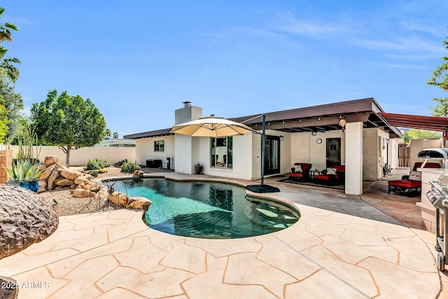 view of swimming pool featuring a patio area, a fenced backyard, and a fenced in pool