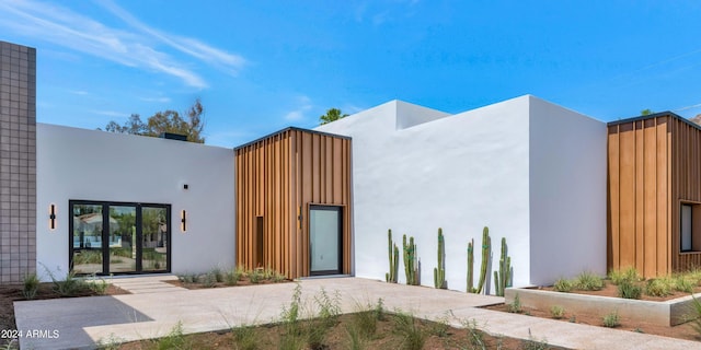 exterior space featuring stucco siding