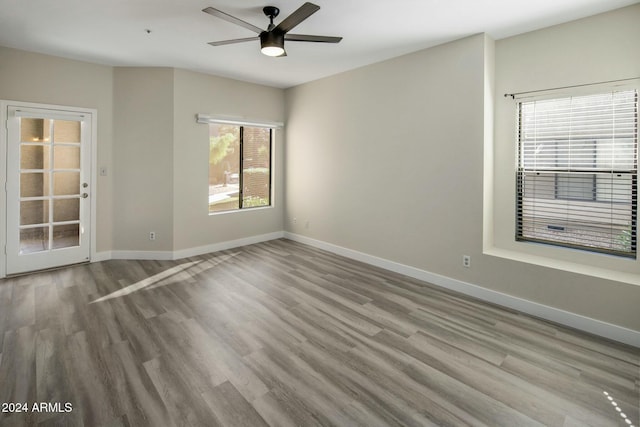 spare room featuring ceiling fan and light wood-type flooring