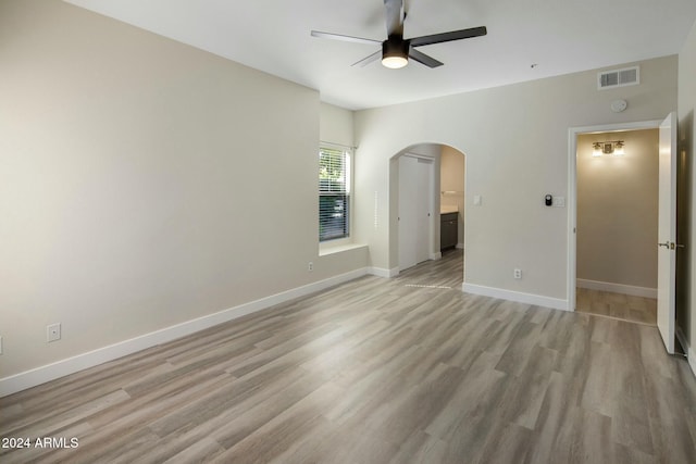 spare room with light hardwood / wood-style flooring and ceiling fan