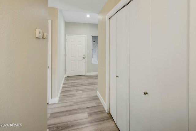 corridor with light wood-type flooring