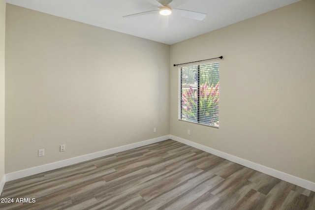 spare room featuring ceiling fan and light wood-type flooring