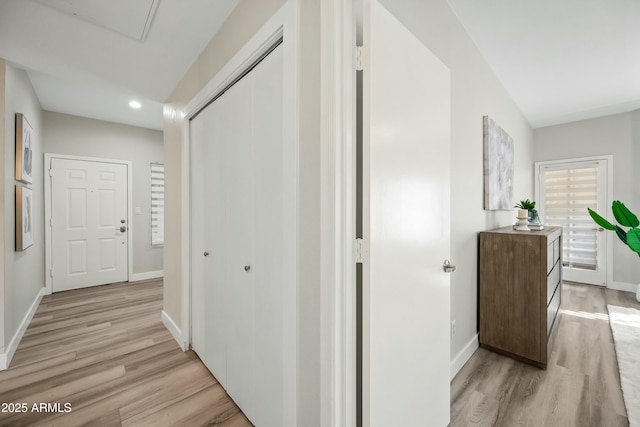 corridor featuring light hardwood / wood-style floors