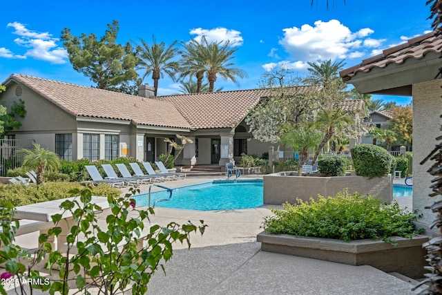 view of pool featuring a patio area