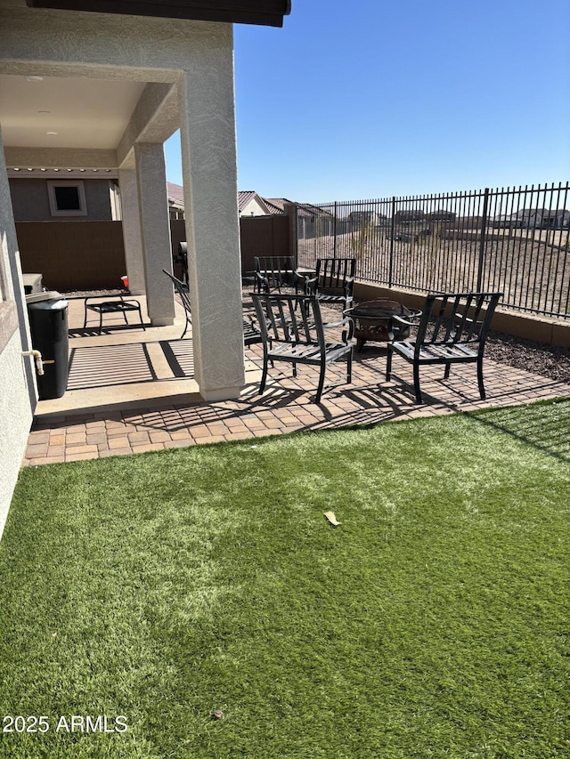 view of yard with a patio and fence