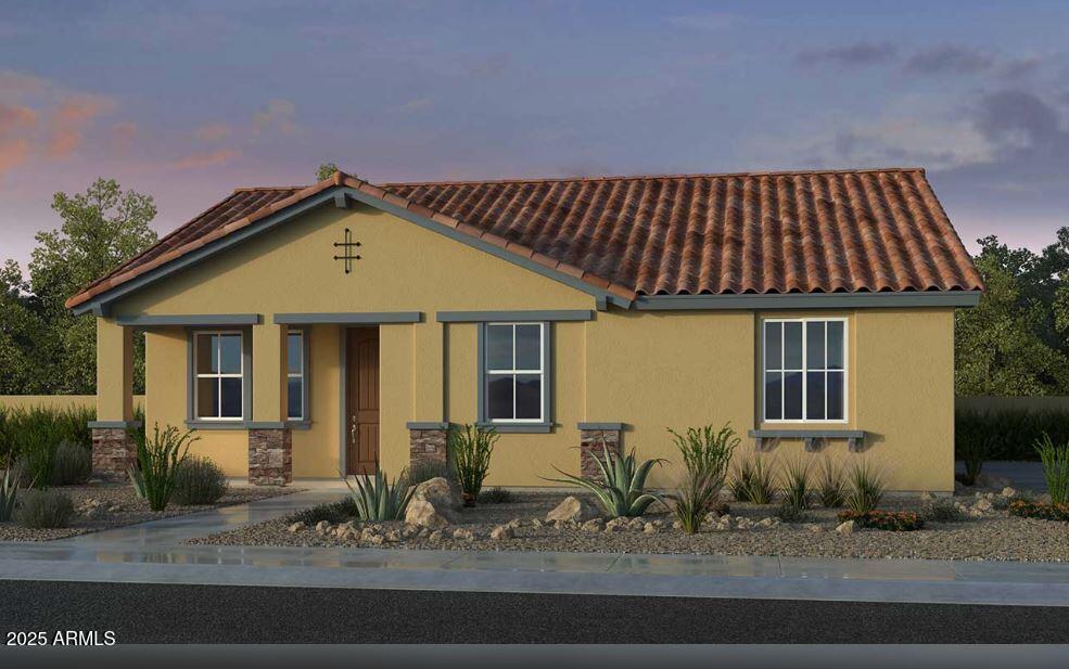 mediterranean / spanish-style house with a tiled roof and stucco siding