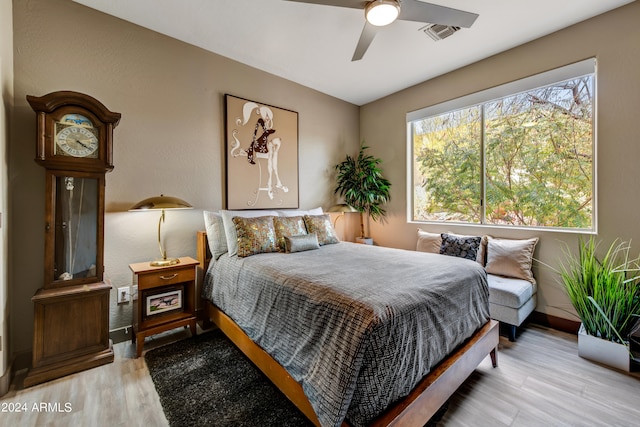 bedroom featuring light hardwood / wood-style floors and ceiling fan