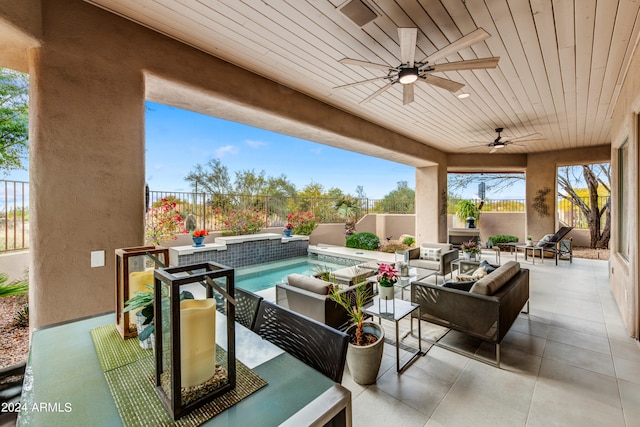 view of patio with ceiling fan and an outdoor hangout area