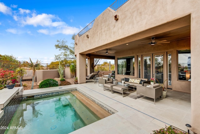 view of swimming pool featuring a patio, ceiling fan, and an outdoor hangout area