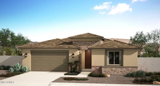 18048 W Larkspur Dr, Goodyear, AZ 85338 - view of front of house with concrete driveway, stucco siding, an attached garage, and brick siding
