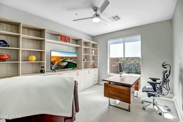 office featuring ceiling fan and light colored carpet