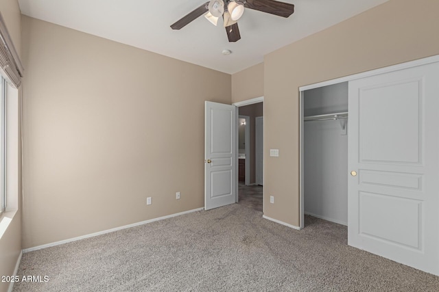 unfurnished bedroom with a ceiling fan, a closet, light colored carpet, and baseboards