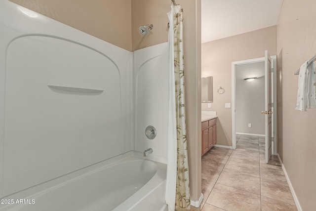 bathroom with baseboards, shower / bath combo, vanity, and tile patterned floors