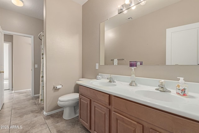 full bath with tile patterned flooring, visible vents, a sink, and double vanity