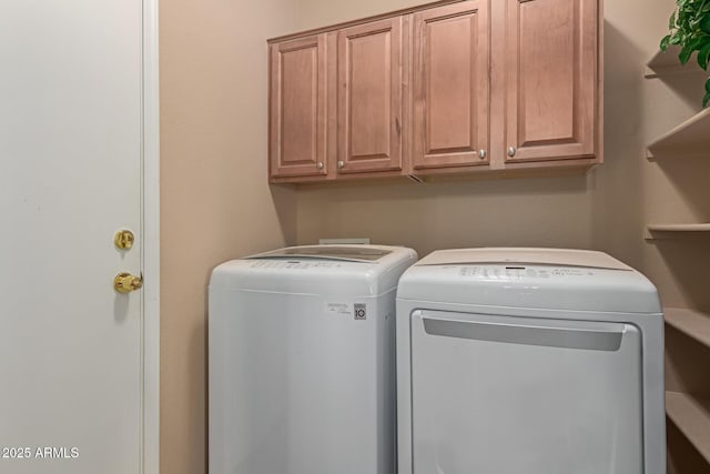 laundry room featuring cabinet space and washing machine and dryer