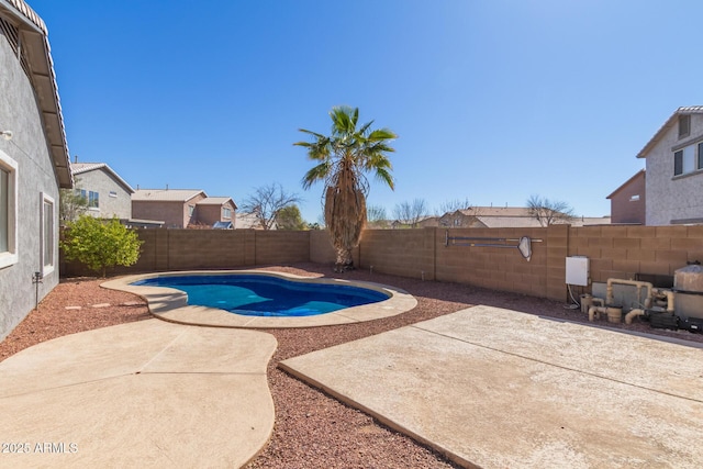 view of pool with a patio area, a fenced backyard, and a fenced in pool