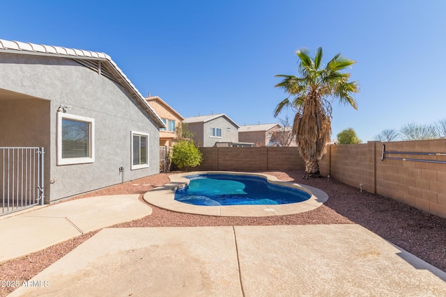 view of pool featuring a patio area, a fenced backyard, and a fenced in pool